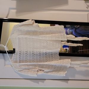 American Attitudes Crochet lace tie cropped sweater.